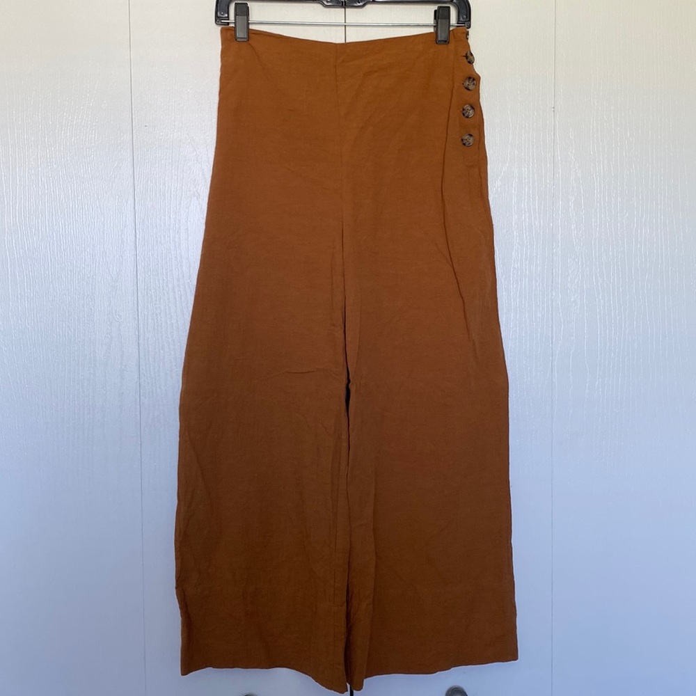 Brown/orange pants with leopard print buttons